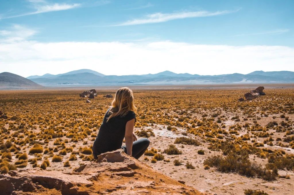Girl looking at the desert horizon in Los Cabos.