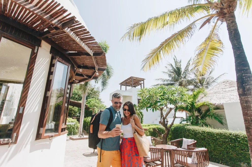 Couple enjoying their new home thanks to real estate in Mexico.