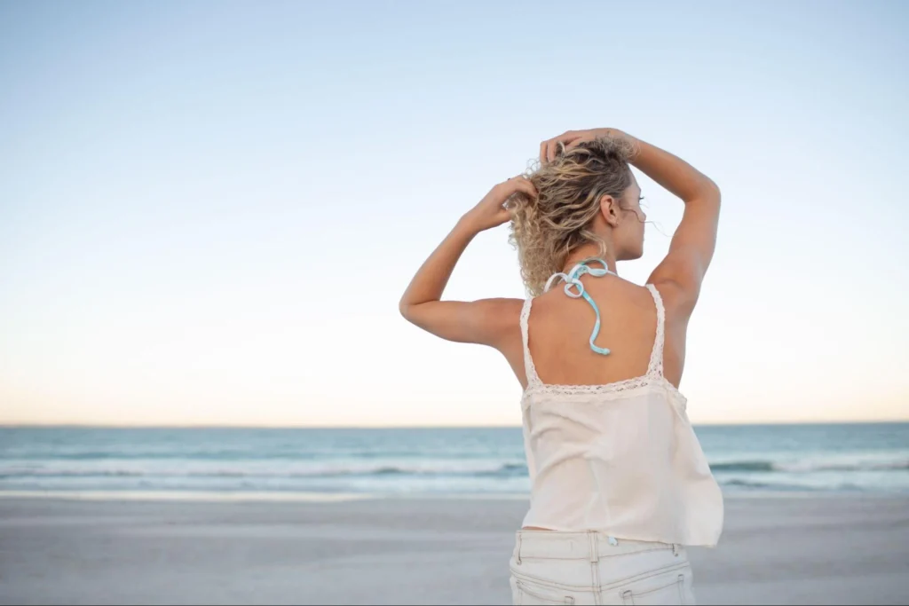 Woman in white admiring the sea at Los Cabos.
